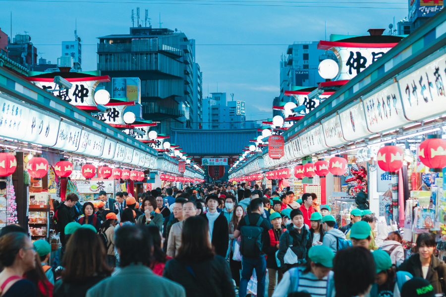Crowds shopping along Nakamise Street in Asakusa, Tokyo at dusk